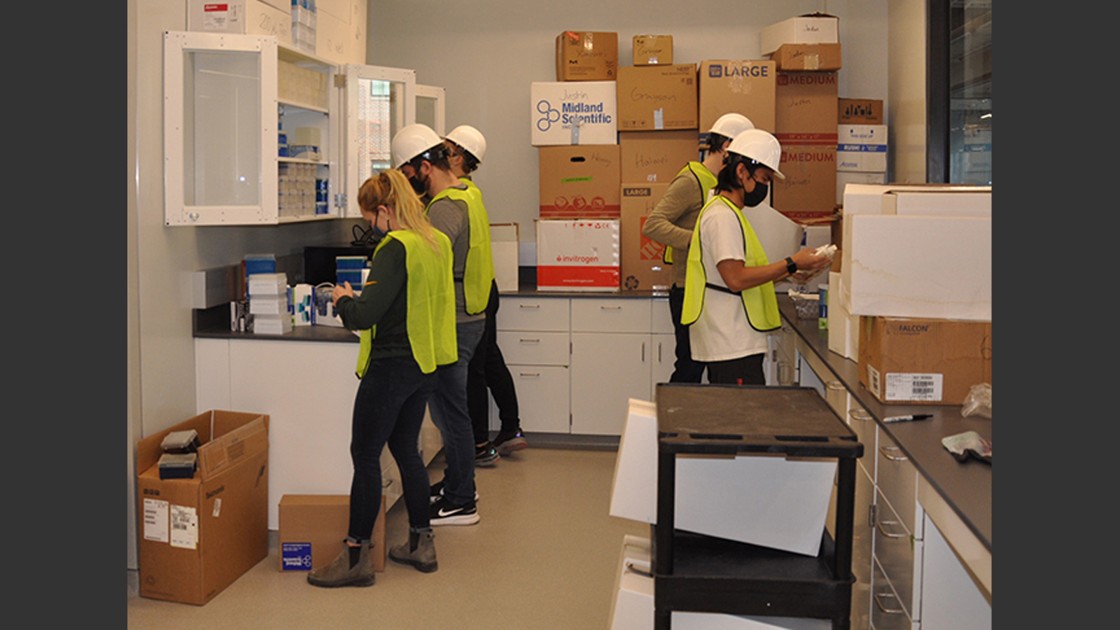 Students move supplies into new lab space in the College of Engineering
