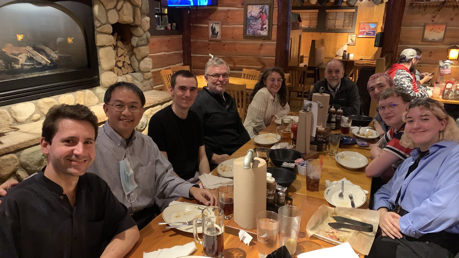 Faculty and students celebrating with dinner in a local restaurant