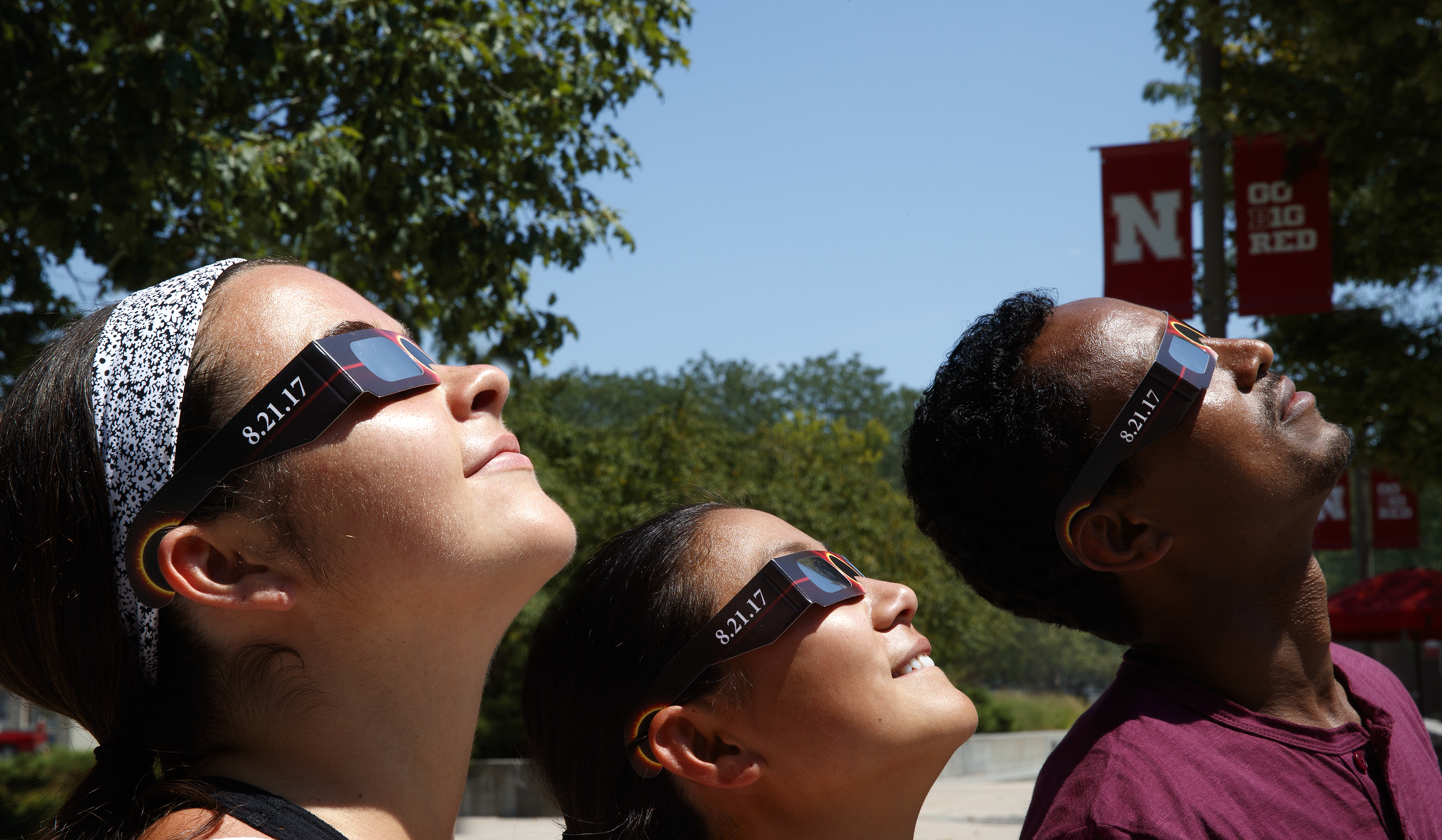 Students look at the sun using specialized glasses. The university will provide the glasses to students for the Aug. 21 total solar eclipse.