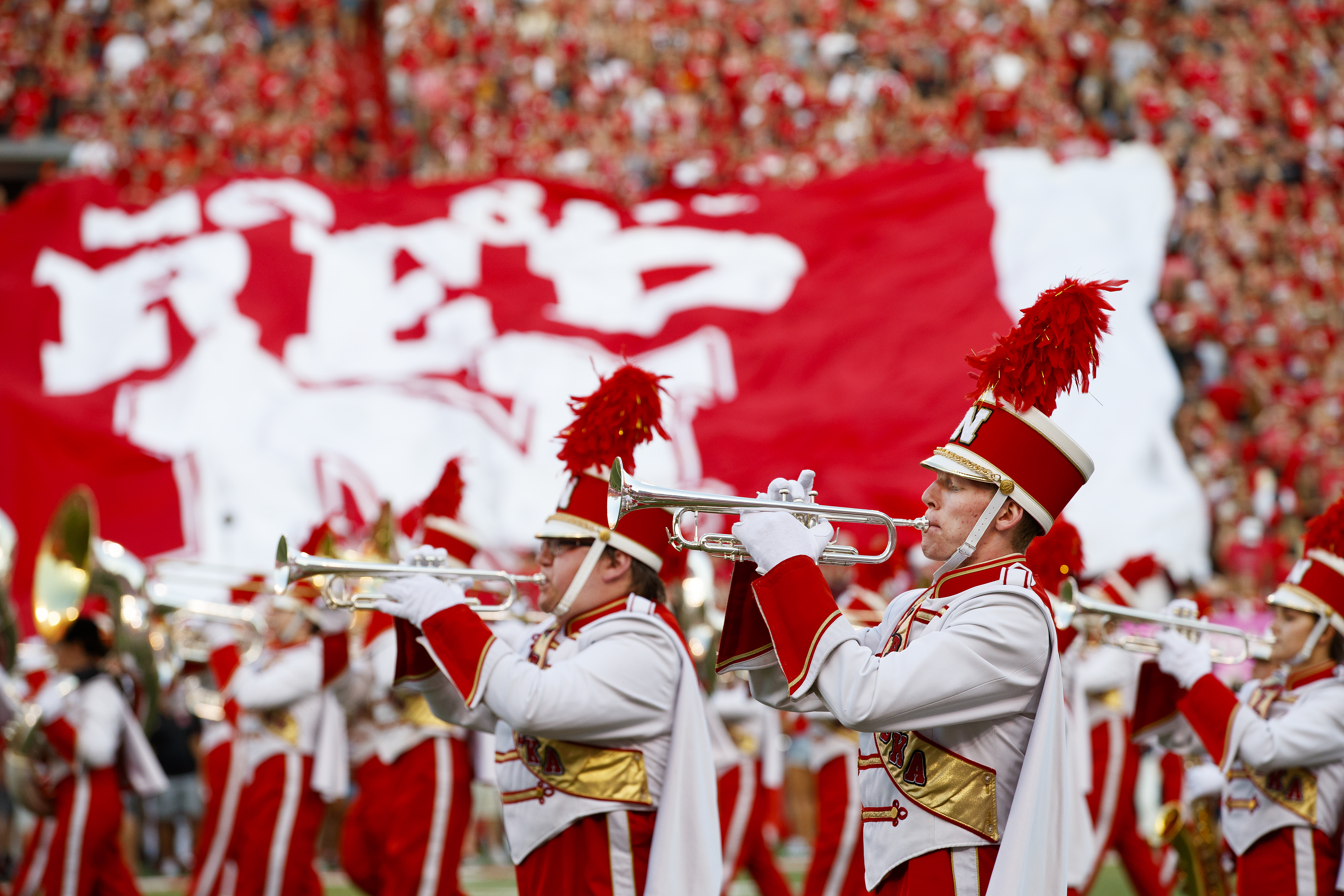 The Cornhusker Marching Band performs at the start of the Sept. 2 game with Arkansas State University. More than 30 members of the band are participating in the 22in22 Challenge, which is designed to raise awareness about veteran suicides and raise funds for veteran support services.
