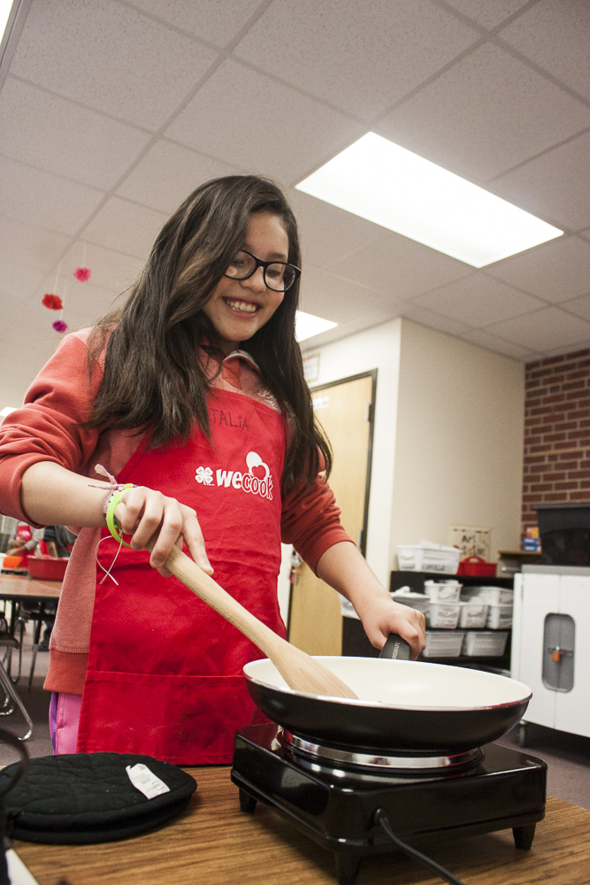 Nhatalia Martinez Enriquez participates in the WeCook program Feb. 18 at West Lincoln Elementary.