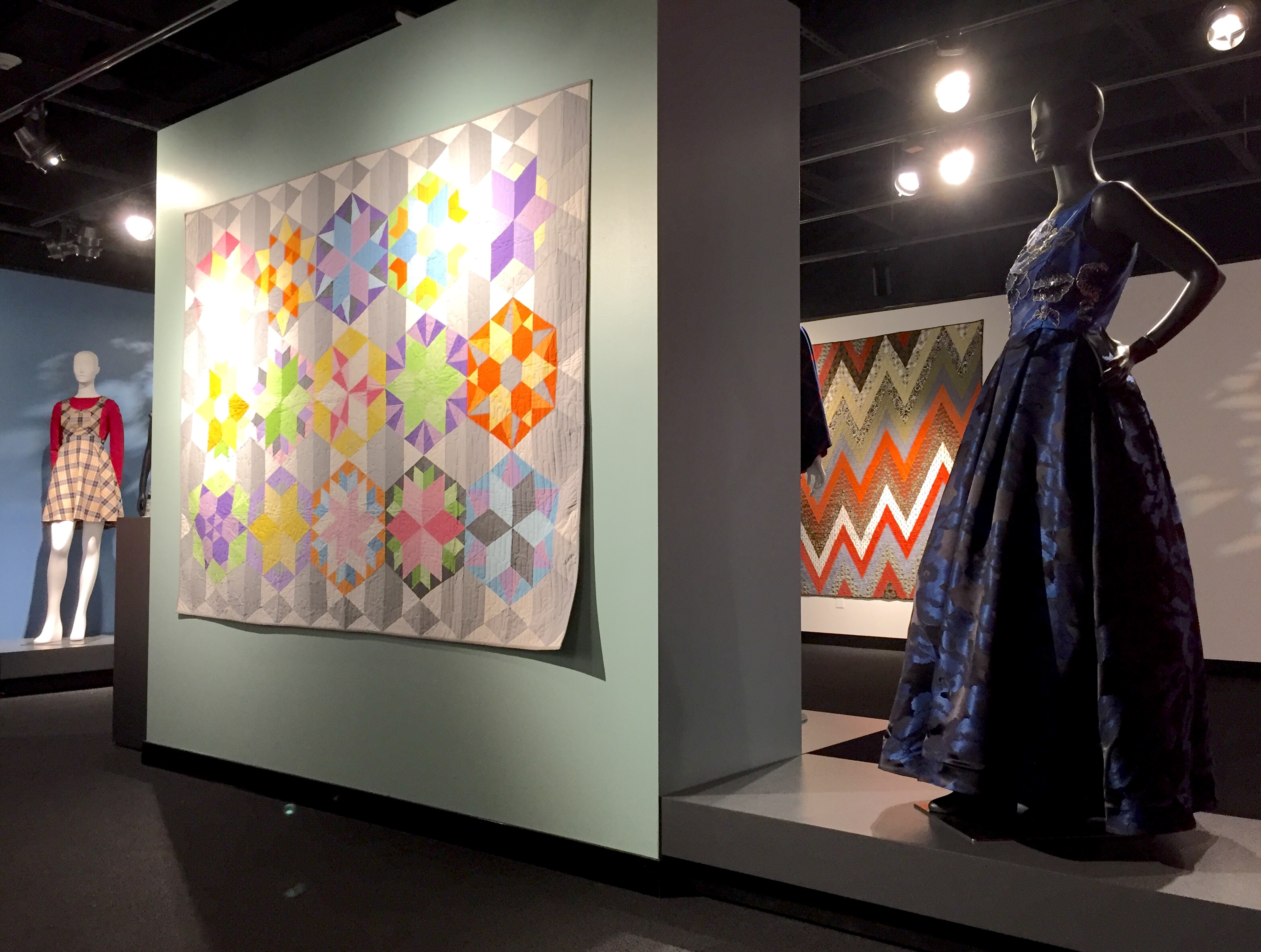 (Foreground) Park Bench Quilt, Eliana Babcock of Waverly, 15; hand-beaded blue gown, Marta Pulfer of Wayne, 18; (background) plaid jumper with red sweater, Karla Herrarte of Lexington, 12; Zig Zag Fall Colors, Sarah Lucht of Kearney, 15.