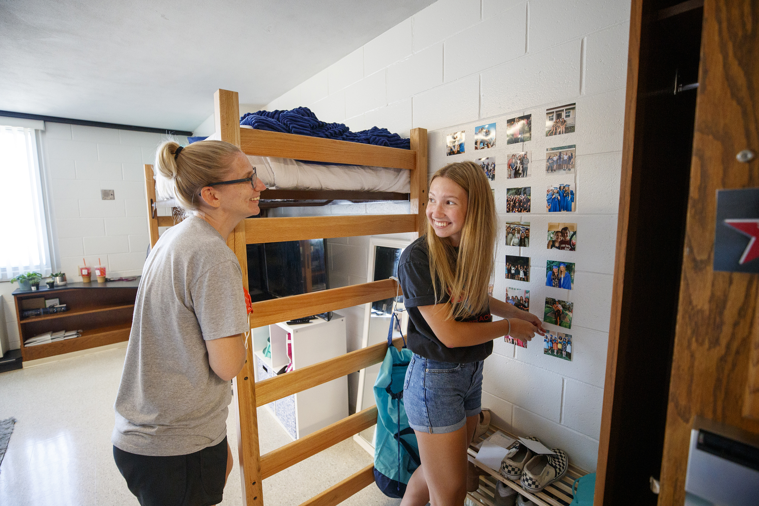 Miqaela Davis (right), from Omaha, smiles at her mom, Monica, after finishing decorating one of her walls in August 2020. The majority of Husker students using the residence halls will move in Aug. 15-19, with curbside service again provided.