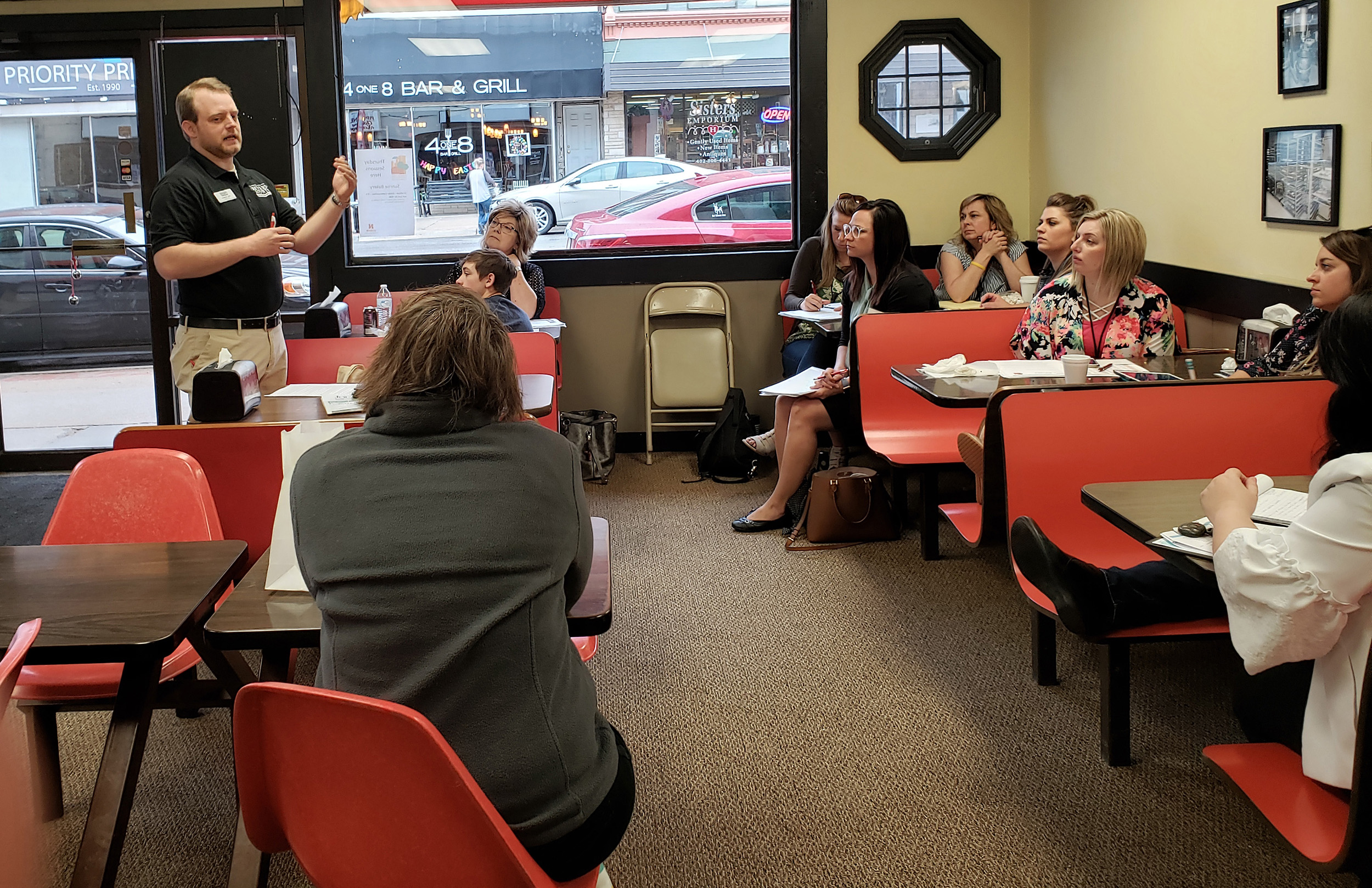 Jonathan Jank, president and CEO of the Seward County Chamber and Development Partnership, speaks at the Sunrise Bakery in McCook during the 2019 CEC Conference.