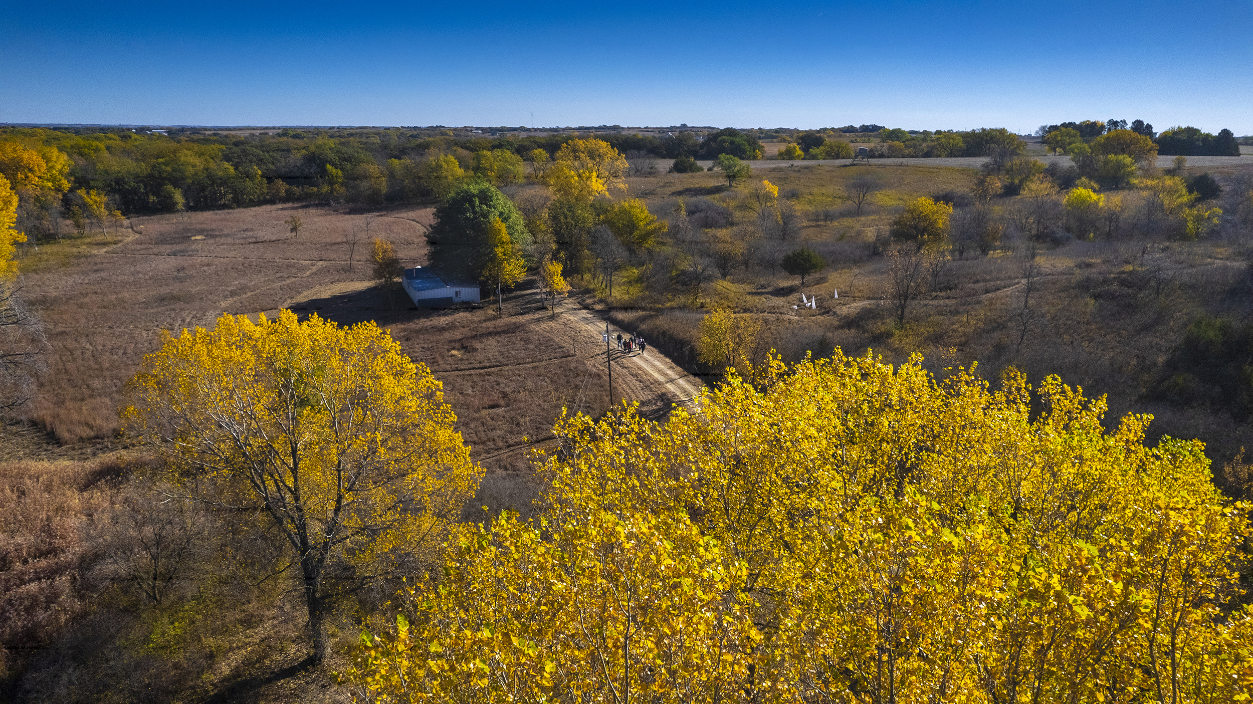 An aerial photo shows academic advisers as they tour Reller Prairie in southwest Lancaster County. Oct. 17.