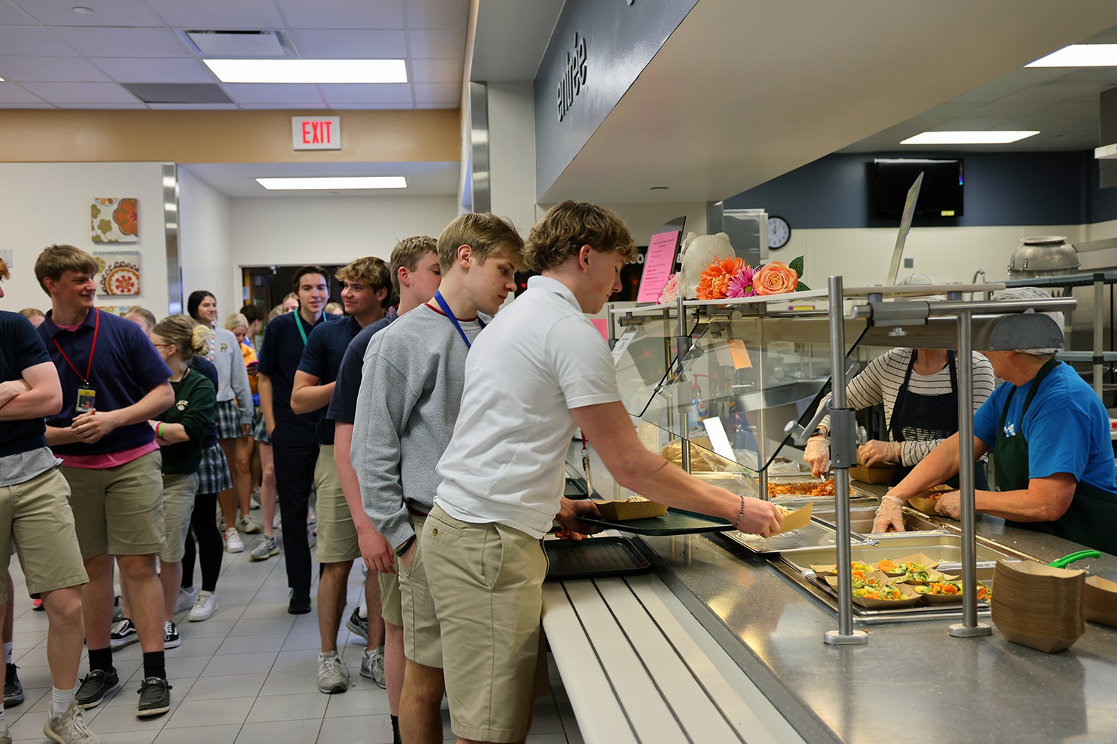 Students receive their lunches at Pius X High School in Lincoln.