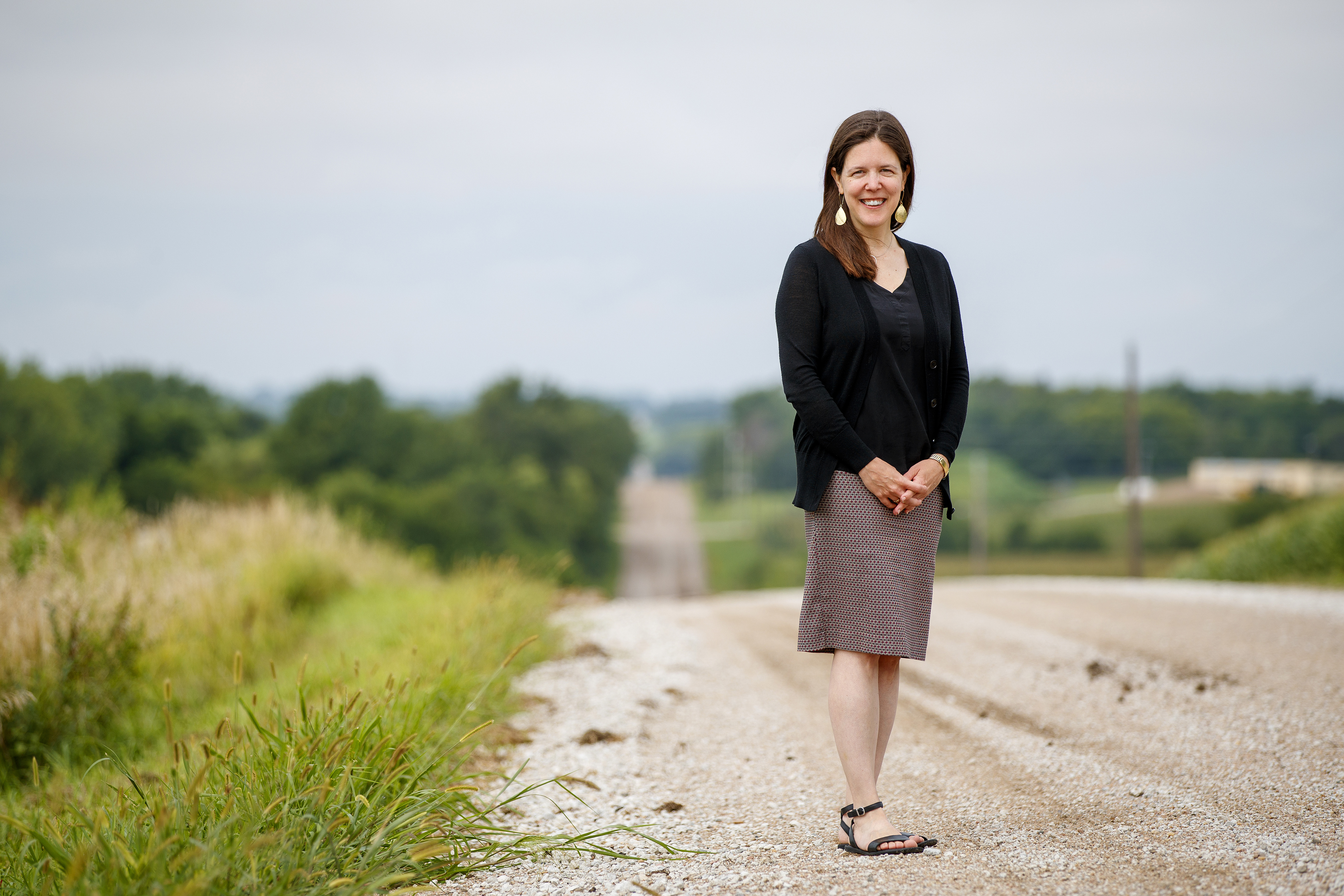 Jessica A. Shoemaker, Steinhart Foundation Distinguished Professor of Law, stand on a gravel road.