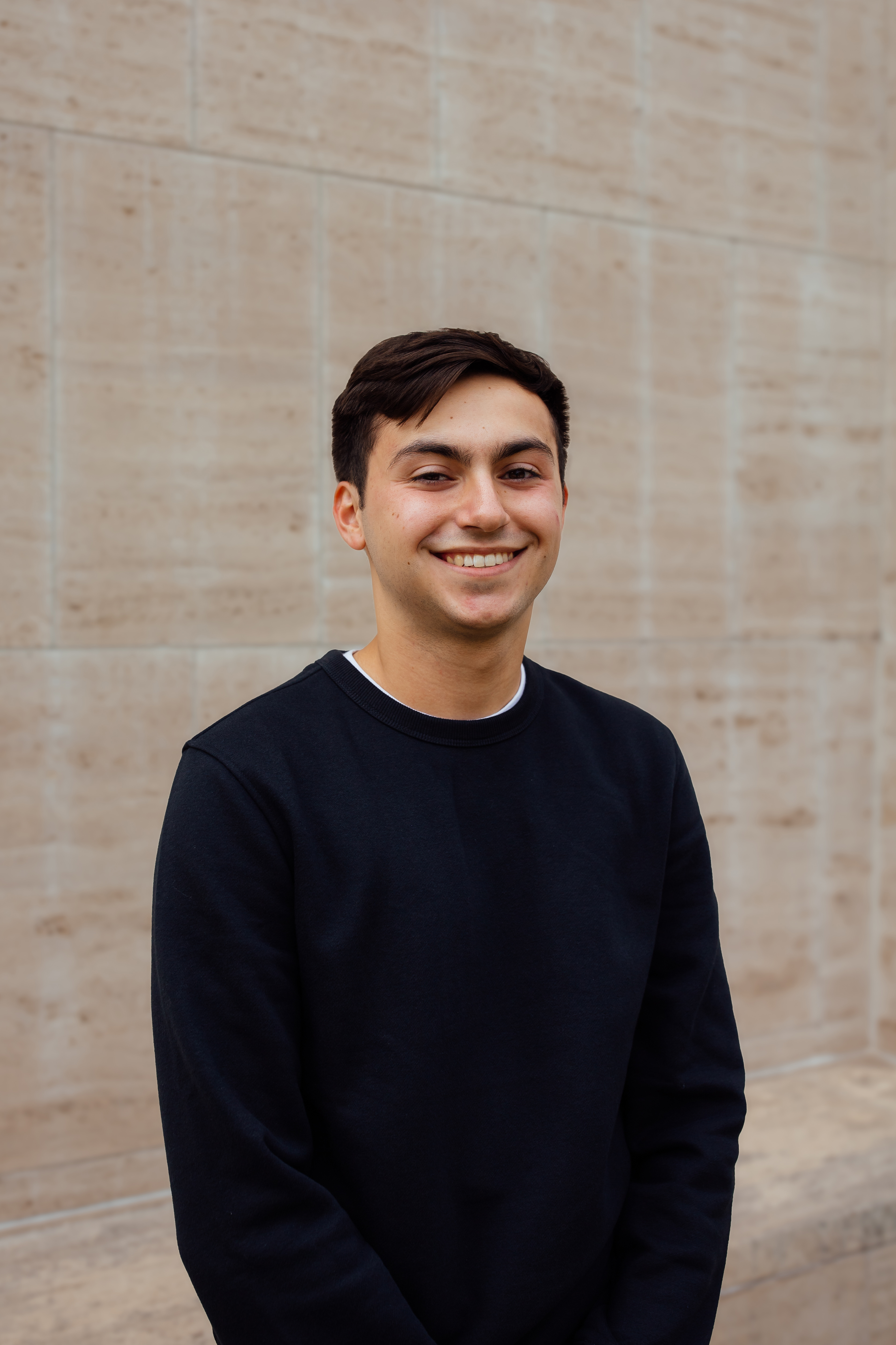 Anthony Rubek, senior journalism and sports media and communication major at the University of Nebraska–Lincoln. He is wearing a black sweatshirt.