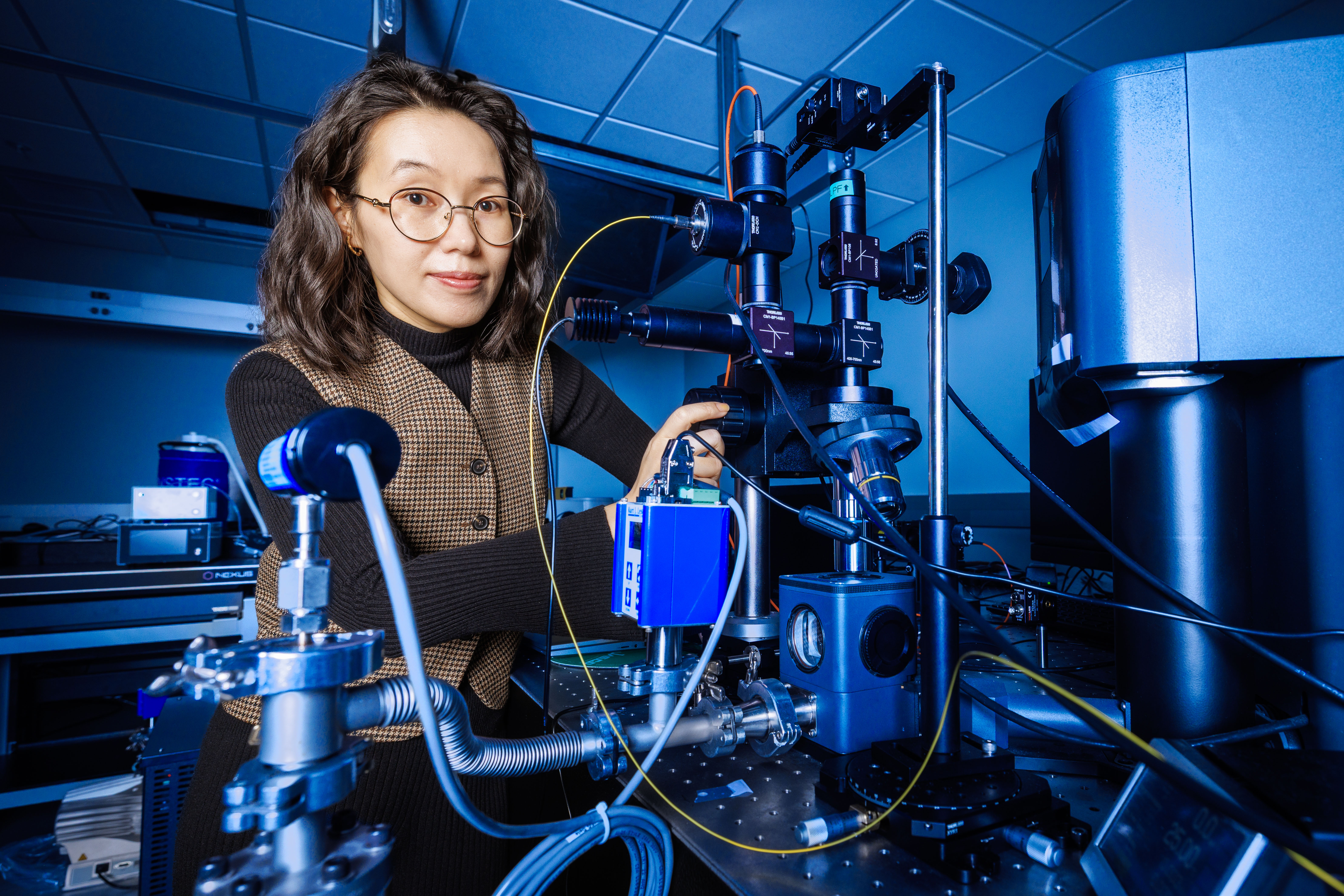 Yanan (Laura) Wang, assistant professor of electrical and computer engineering at the University of Nebraska–Lincoln, operates a laser interferometer inside her lab at the Engineering Research Center.