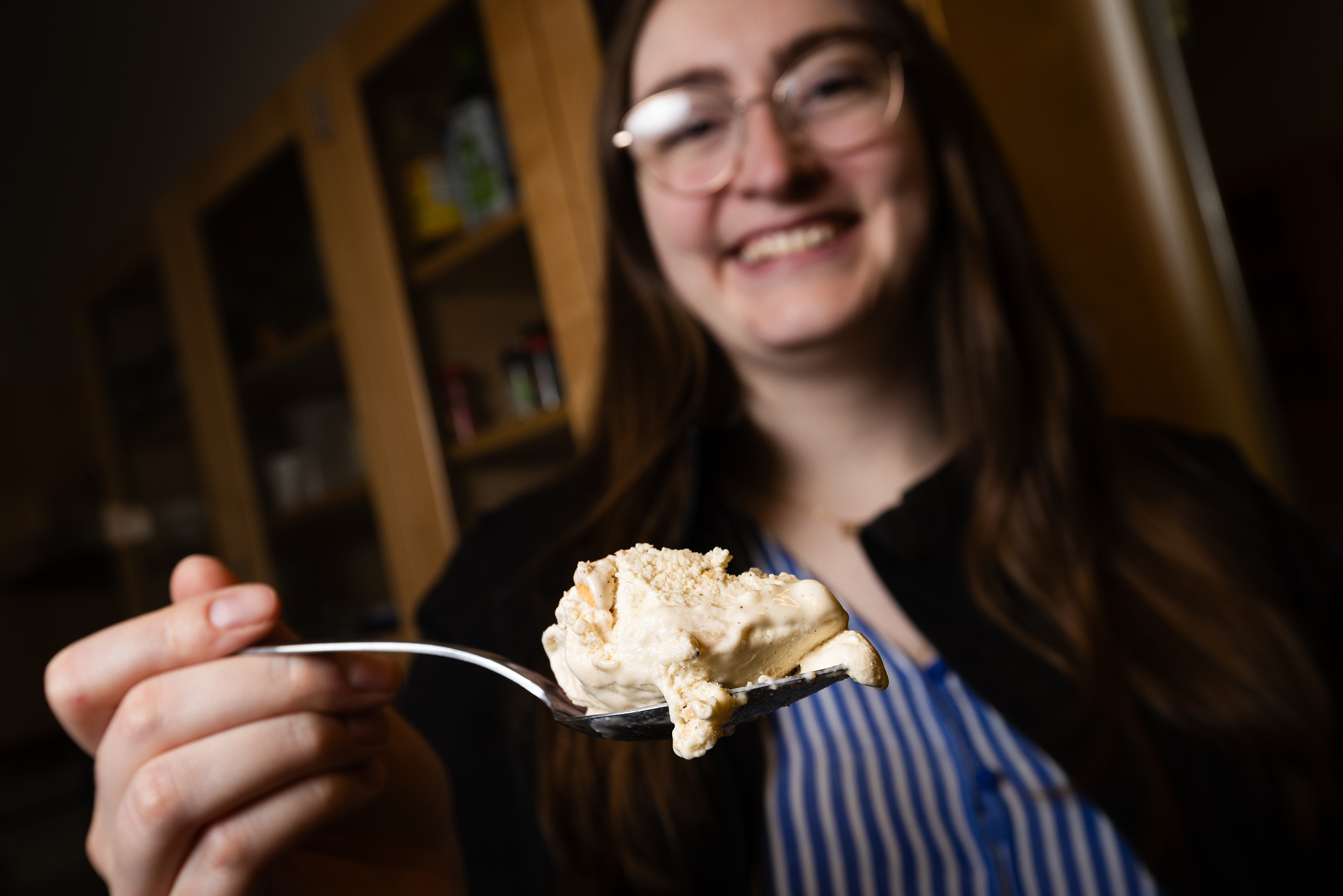 April Johnson, product development project manager in the Food Processing Center, poses with a container of Runza-flavored ice cream in the product development lab. Johnson led development of the limited-release frozen treat, which contains Runza's unique spice blend, cabbage flavor and pie dough in place of bread.