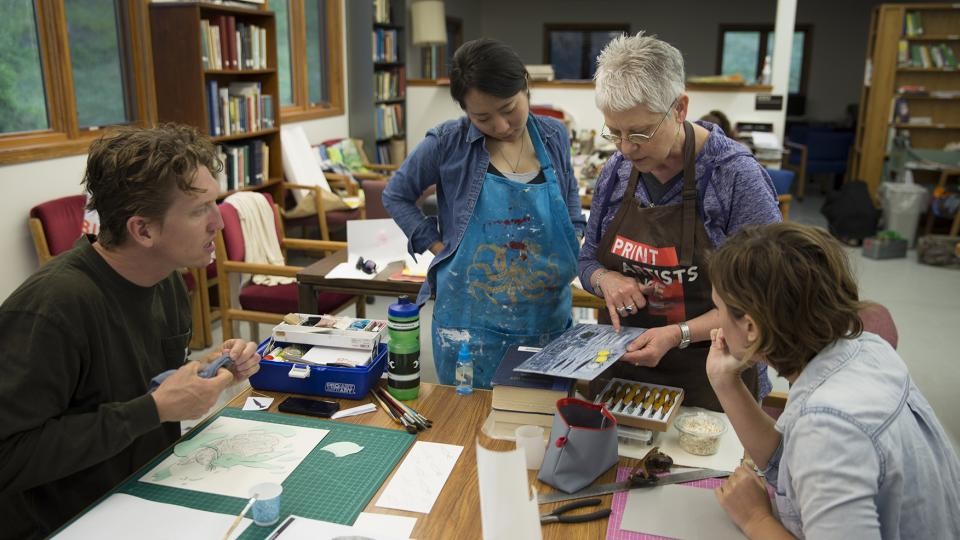 Cather Professor of Art Karen Kunc discusses a printmaking technique with students enrolled in the Art at Cedar Point course in summer 2015. The new summer course is held at the UNL's Cedar Point Biological Station and allows students to focus solely on creating art for 