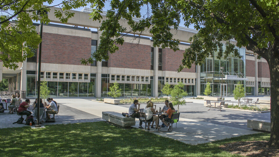 Students studying outside Adele Hall Learning Commons.