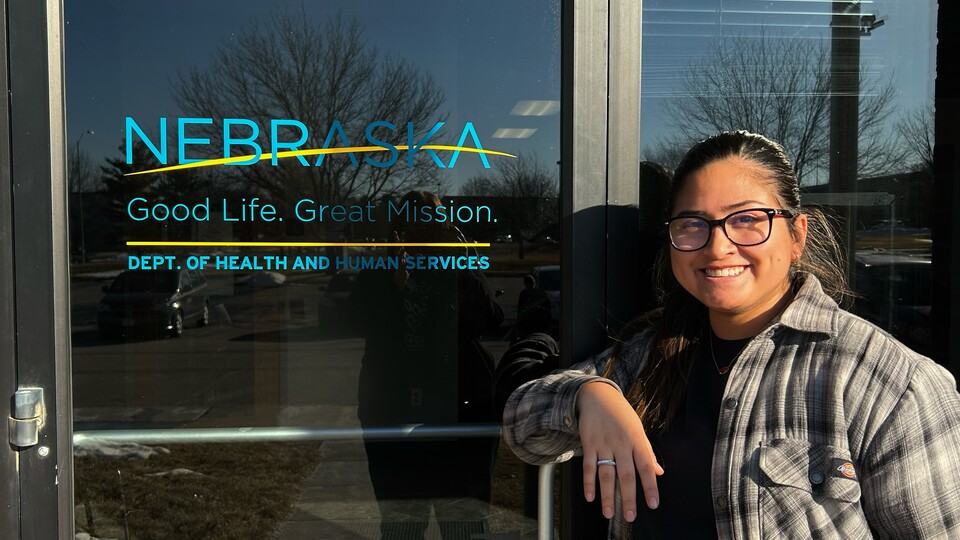 Ashly Felipe-Espino, recent UNL alumni stands in front of Dept. of Health and Human Services