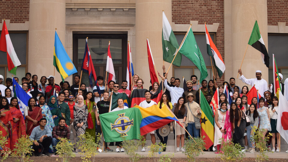 International students from around the countries hold their homeland flags as in Homecoming 2021 ©Office of Global Strategies