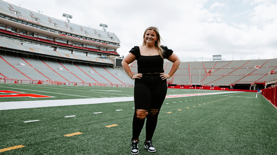 Gross on the field of Memorial Stadium. As a first-year sports media and communication major and intern with Husker Athletics, Meg is already garnering hands-on experience covering a variety of Husker sporting events.  