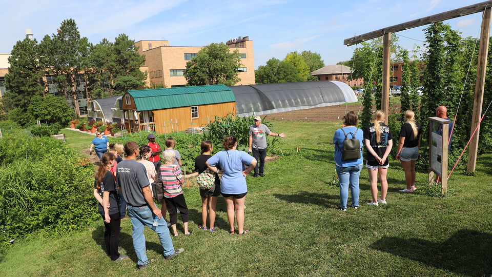Nebraska high school students and their families listen to Stacy Adams, The Biggest Grower program coordinator, speak about speciality crop production near the East Campus Hops Planting Garden on June 30. Lana Koepke Johnson | Agronomy and Horticulture 