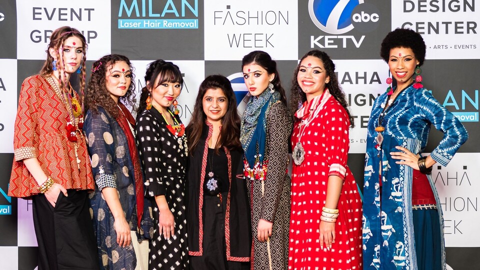 Ritu Jadwani (center) with the six handcrafted looks she showcased at Omaha Fashion Week. (Credit: Omaha Fashion Week)