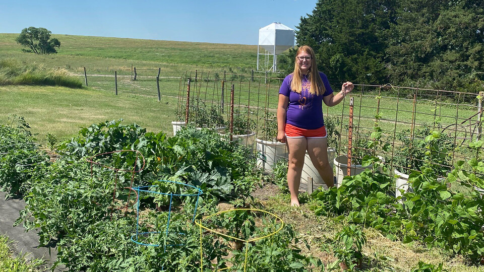 The Biggest Grower participant Shauna Radant of Team Kohlrabi shows off her competition garden near Valentine, Nebraska, this summer.