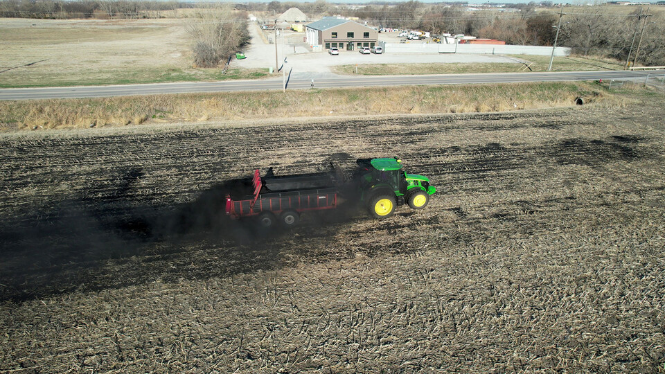 Biochar is applied to 16 acres of farmland in northeast Lincoln with a manure spreader during University of Nebraska–Lincoln research trials in April.