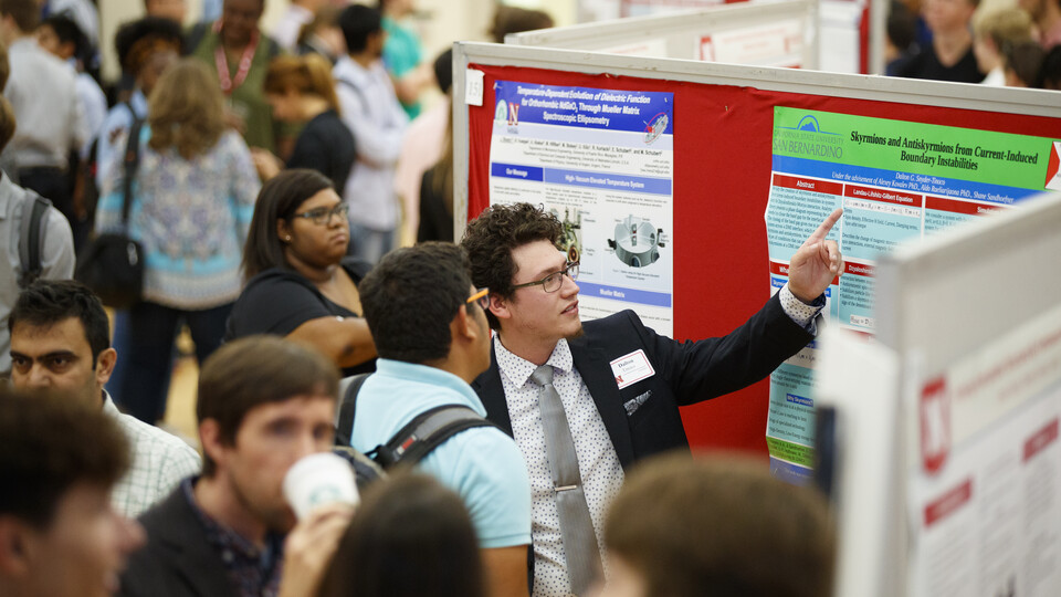 Student presenting research at the Nebraska Summer Research Symposium
