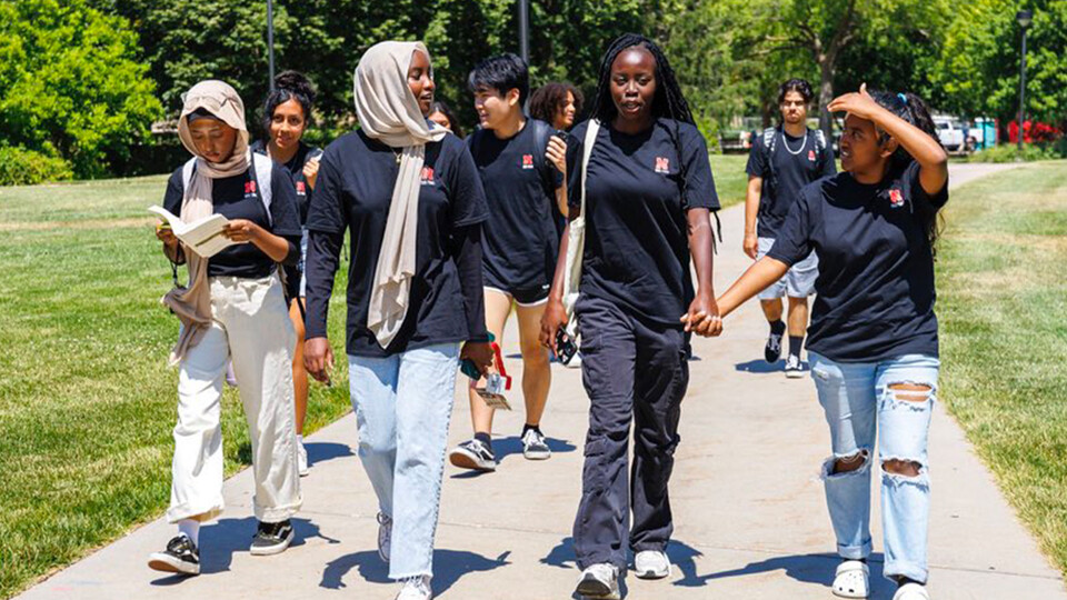 Members of STEM-POWER program walking on campus