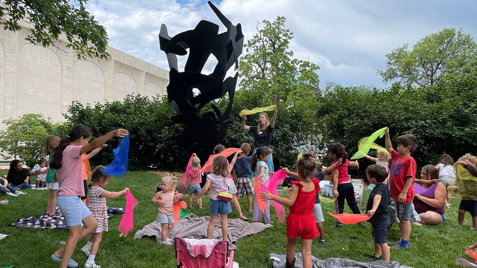 Children dancing near Sheldon Museum of Art