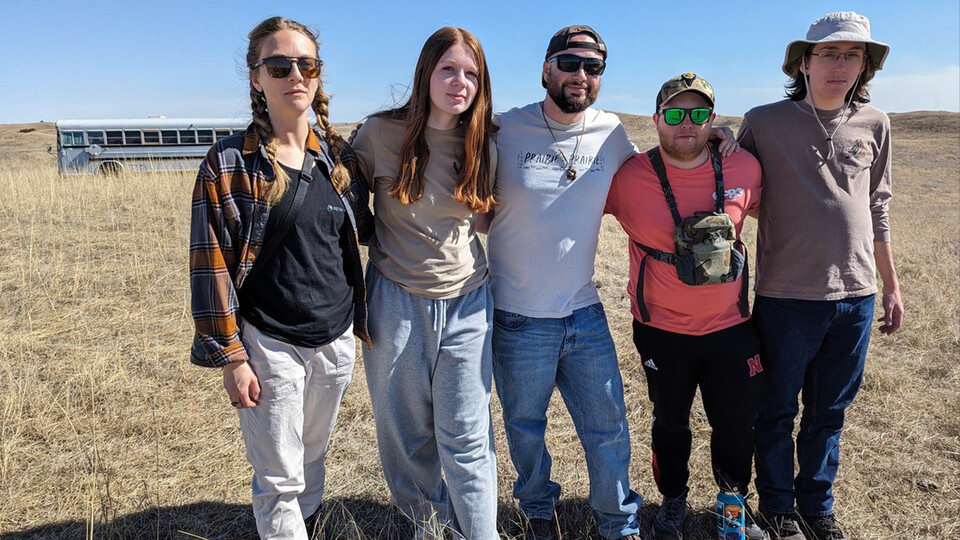 Five Husker students stand amid the Nebraska Sandhills