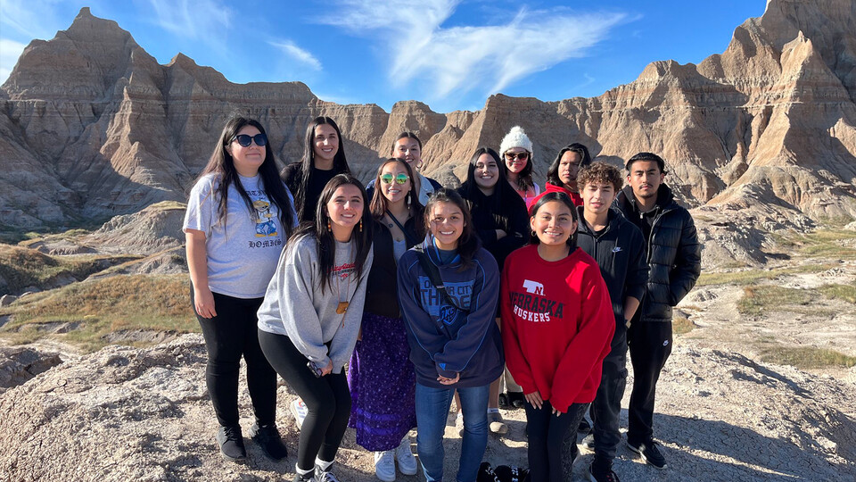 A group photo of students from the University of Nebraska Inter-Tribal Exchange at Badlands National Park