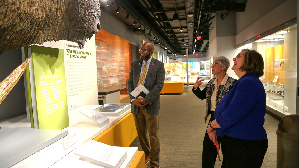 Susan Weller walks Rodney Bennett and Sherri Jones through an exhibit at the University of Nebraska State Museum