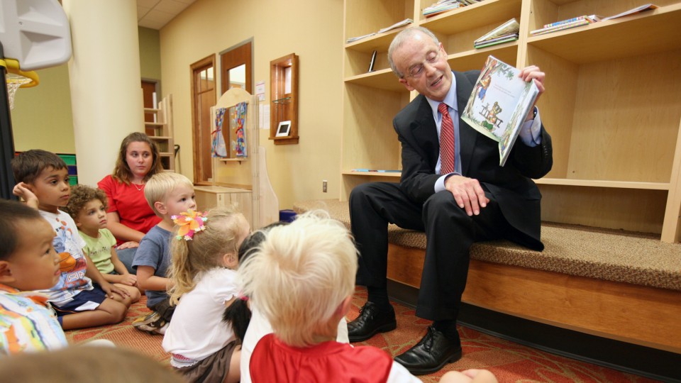 Chancellor Harvey Perlman reads a book to youth at the UNL Children's Center. The UNL Children's Center has earned accreditation from the National Association for the Education of Youth Children.