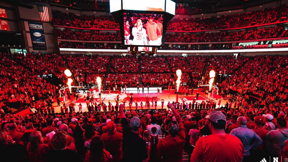 Fire erupts from the court at Pinnacle Bank Arena as Keisei Tominaga is introduced