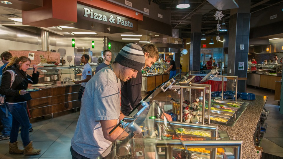 Students pick food items in UNL's Abel-Sandoz dining center. University Dining Services has launched a new app that provides information on menus and hours of service available at UNL dining centers.