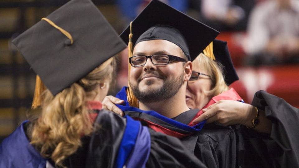 In this 2010 file photo, Andrew Bedrous receives his doctoral degree hood.