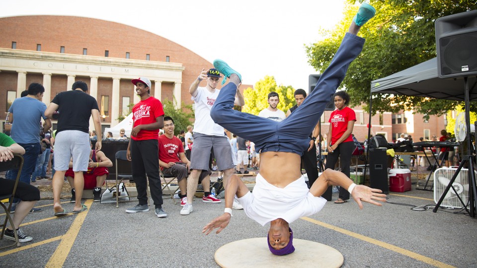 Alumus Rikki Wallace breakdances at a booth promoting UNL's breakdance club during the 2014 Big Red Welcome Street Festival. The event, which draws nearly 10,000 students, will be held Aug. 23 as part of activities that kick off the fall semester at UNL.