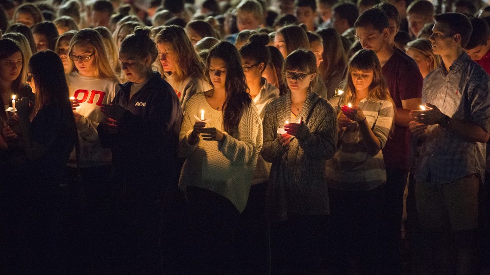 Students participate in a candlelight vigil honoring UNL students Keaton Klein and Clayton Real on Sept. 5, 2014.