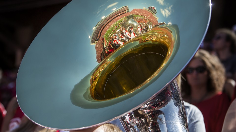 Memorial Stadium is reflected in the bell of a sousaphone during the Sept. 6, 2014 football game against McNeese State. The Cornhusker Marching Band will host 50 additional sousaphone players for a "Tuba Day" performance during halftime on Sept. 12.
