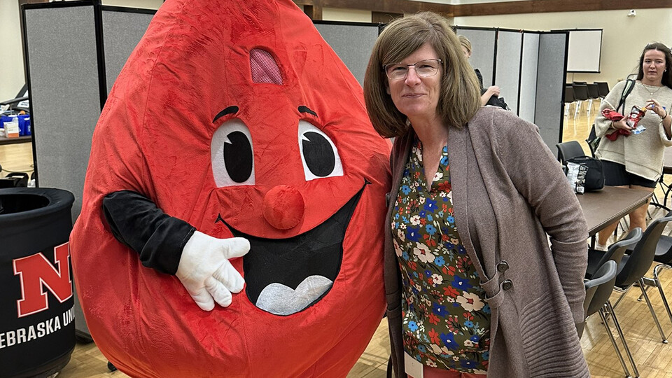 Buddy the Blood Drop poses with Amy Lanhmam at the Homecoming Blood Drive