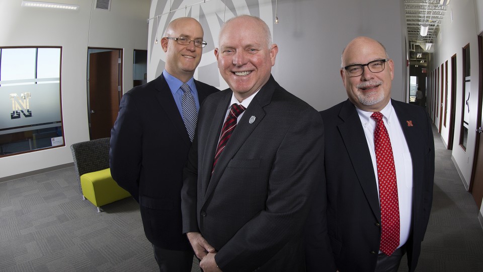 Ryan Anderson, Dan Duncan and Bradley Roth pose in the lobby of Nebraska Innovation Campus’ offices. The trio leads a campus network that helps UNL researchers commercialize their work.