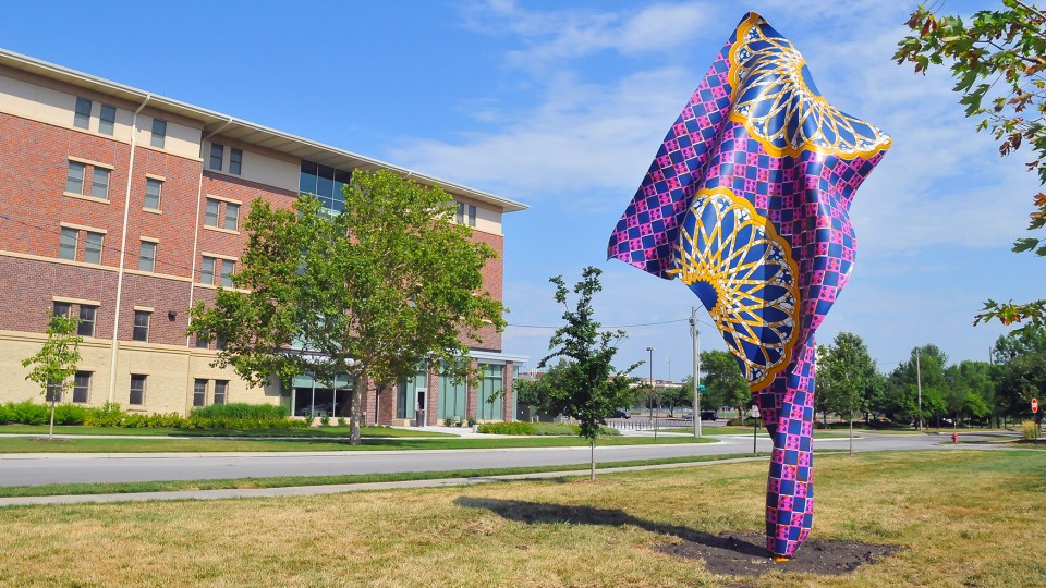 "Wind Sculpture III" by Yinka Shonibare has been added to the collection of UNL's Sheldon Museum of Art. The sculpture, which is made of fiberglass and stands 20 feet tall, is located at 19th Street and North Antelope Valley Parkway.
