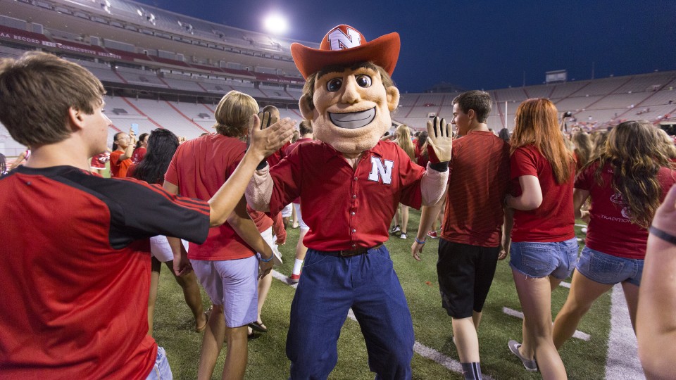 UNL students run into Memorial Stadium during back-to-school activities in 2015. For the second year, UNL is offering the First Husker program to assist first-generation college students with the transition to university life.