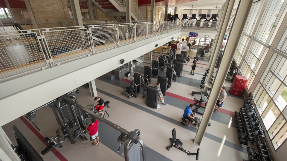 Members of the campus community work out in the Recreation and Wellness Center on East Campus. The facility is home to the university's wellness initiative.