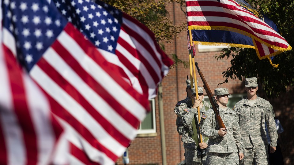 UNL Army ROTC honor guard presents the flag during the memorial for 9-11 on the plaza in front of the Nebraska Union.