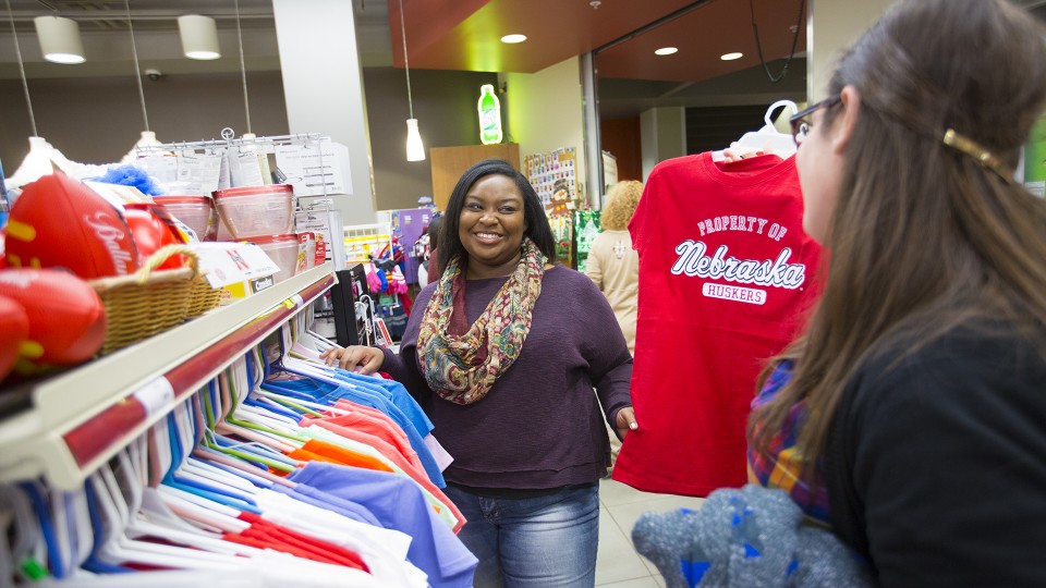 UNL students check out T-shirts available in a UNL convenience store. During March, businesses in Nebraska grew more optimistic about the outlook for sales.