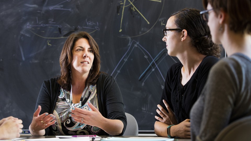 Judy Walker (left) discusses a math question with doctoral students Erica Miller (center) and Allison Beemer. Walker leads a new National Science Foundation-funded project to increase the number of women in mathematics, especially at the doctoral level.