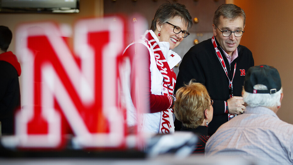 Chancellor Ronnie Green and his wife, Jane, talk with Husker fans on the Nebraska/Maryland football game day in 2016. Green, who has led the university for seven years, announced he will step down in 2023.