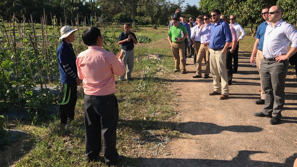 LEAD 35 fellows listen to researchers discuss vegetable cropping systems at the Development and Agricultural Services Center located outside of Vientiane, Laos. 