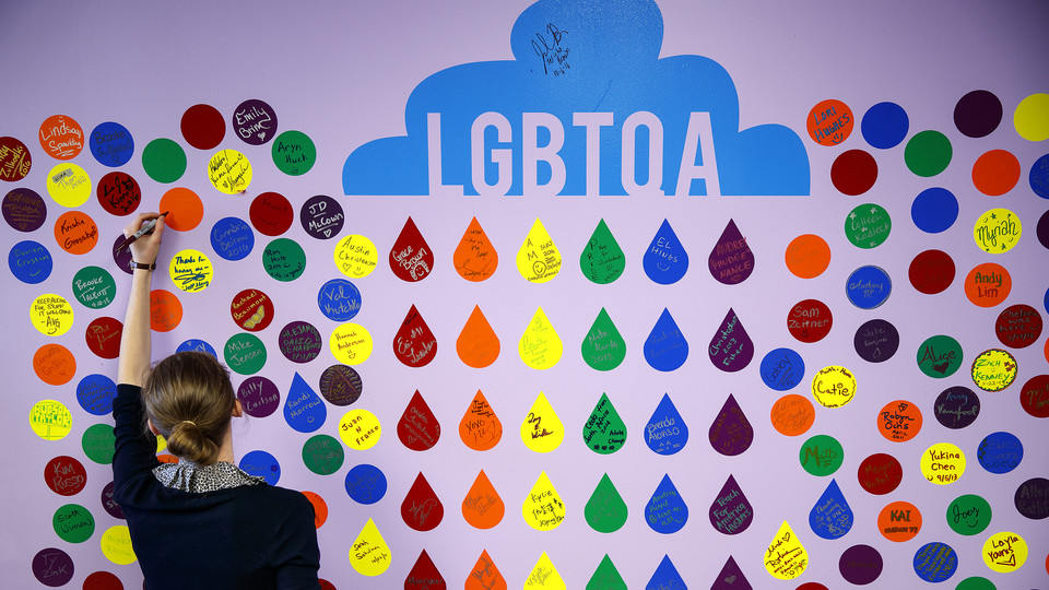A student writes a message on an LGBTQA+ support wall in the Nebraska Union in March 2017. Nominations for the Chancellor's Award for Outstanding Contributions to the Gay, Lesbian, Bisexual and Transgender Community are due by March 22.