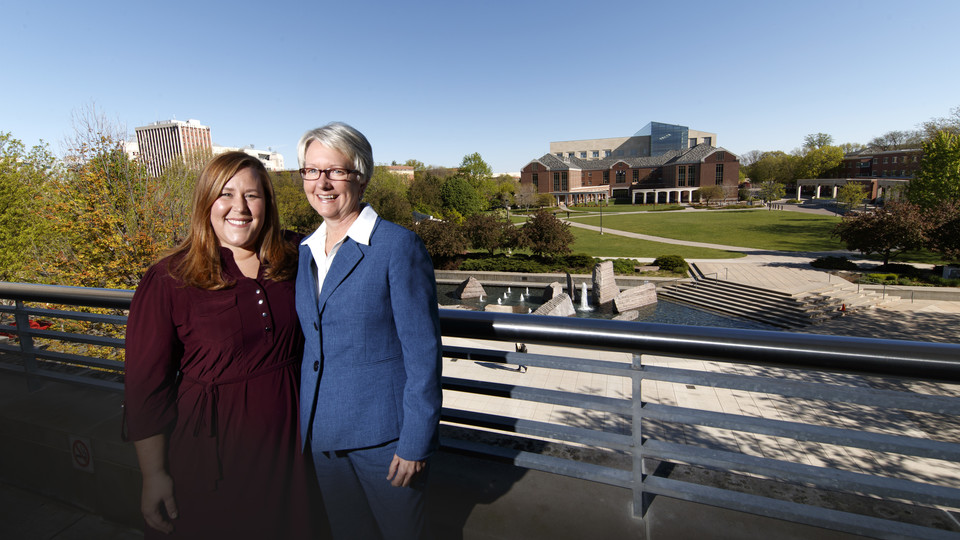 .Ellen Weissinger (right) stands with her niece, Sarah Murphy, director of First-Year Experience and Transition Programs. Weissinger is retiring after more than 40 years of service to the university.