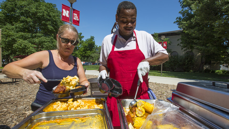 .Kathryn Sildmets and Ron White dish up smoked mac and cheese (left) and New Orleans shrimp boil during a June 16 grill out.