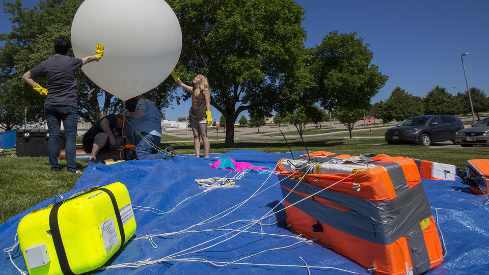 Nebraska's Michael Sibbernsen and students from Metropolitan Community College prepare a high-altitude balloon for launch on June 24. The launch was a test run for a NASA-funded project for the solar eclipse on Aug. 21.